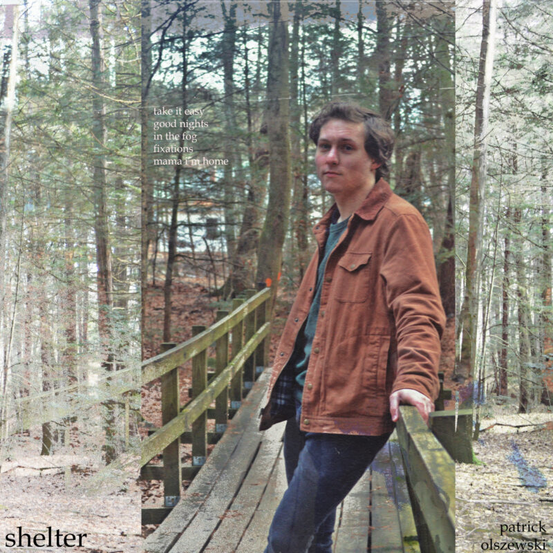 Album cover art of Patrick leaning against a wooden bridge in a pine forest looking at the camera.